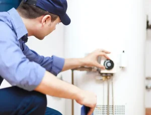 plumber installs new water heater